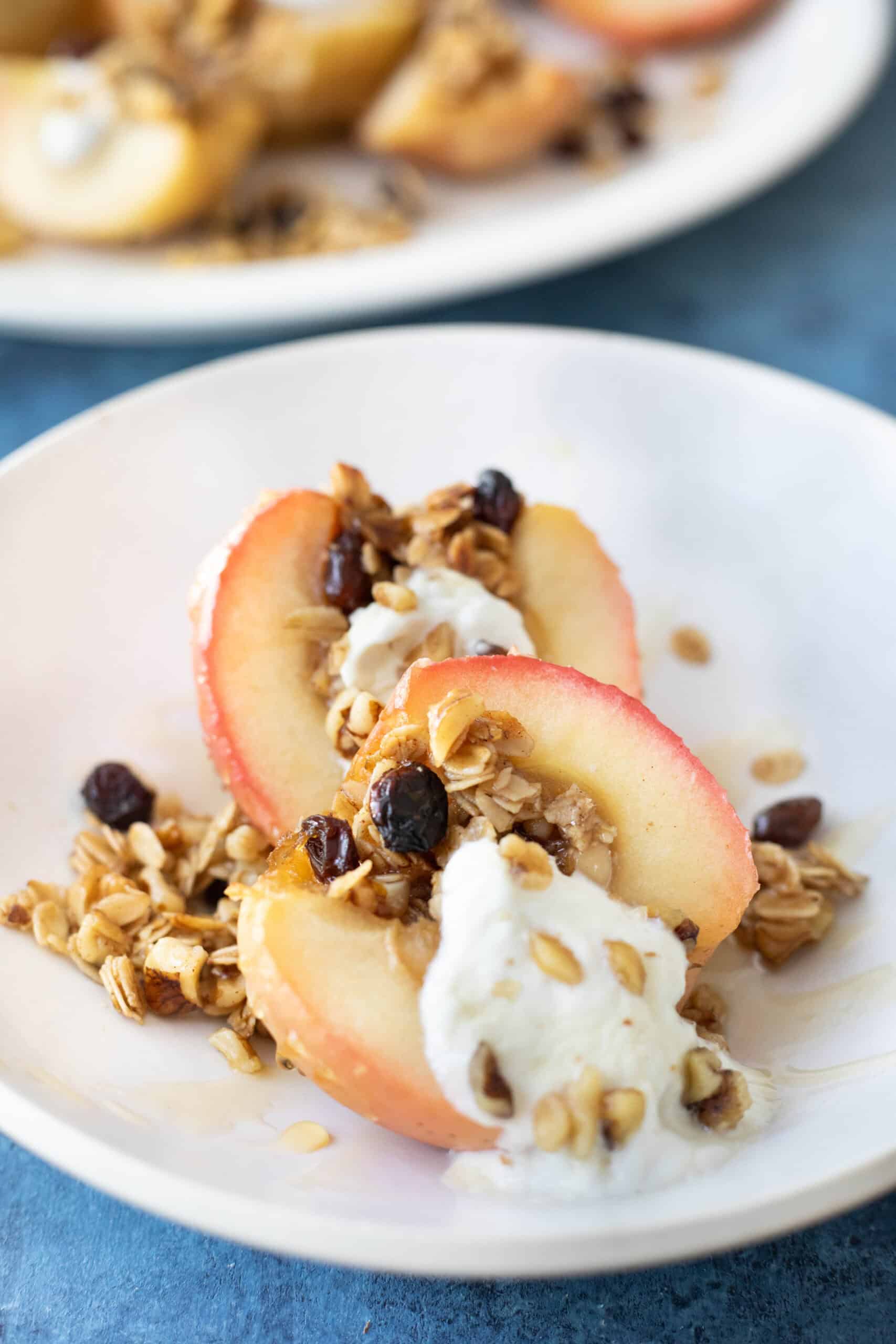 Front shot of baked apples in bowl.
