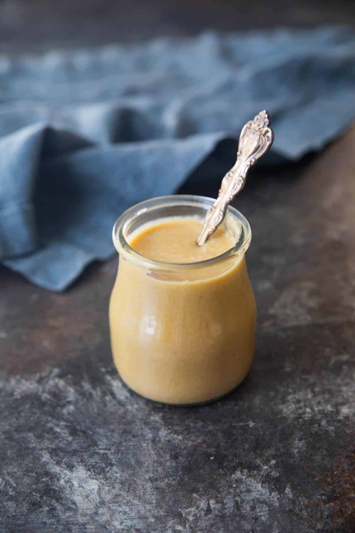 Tahini in a glass jar.