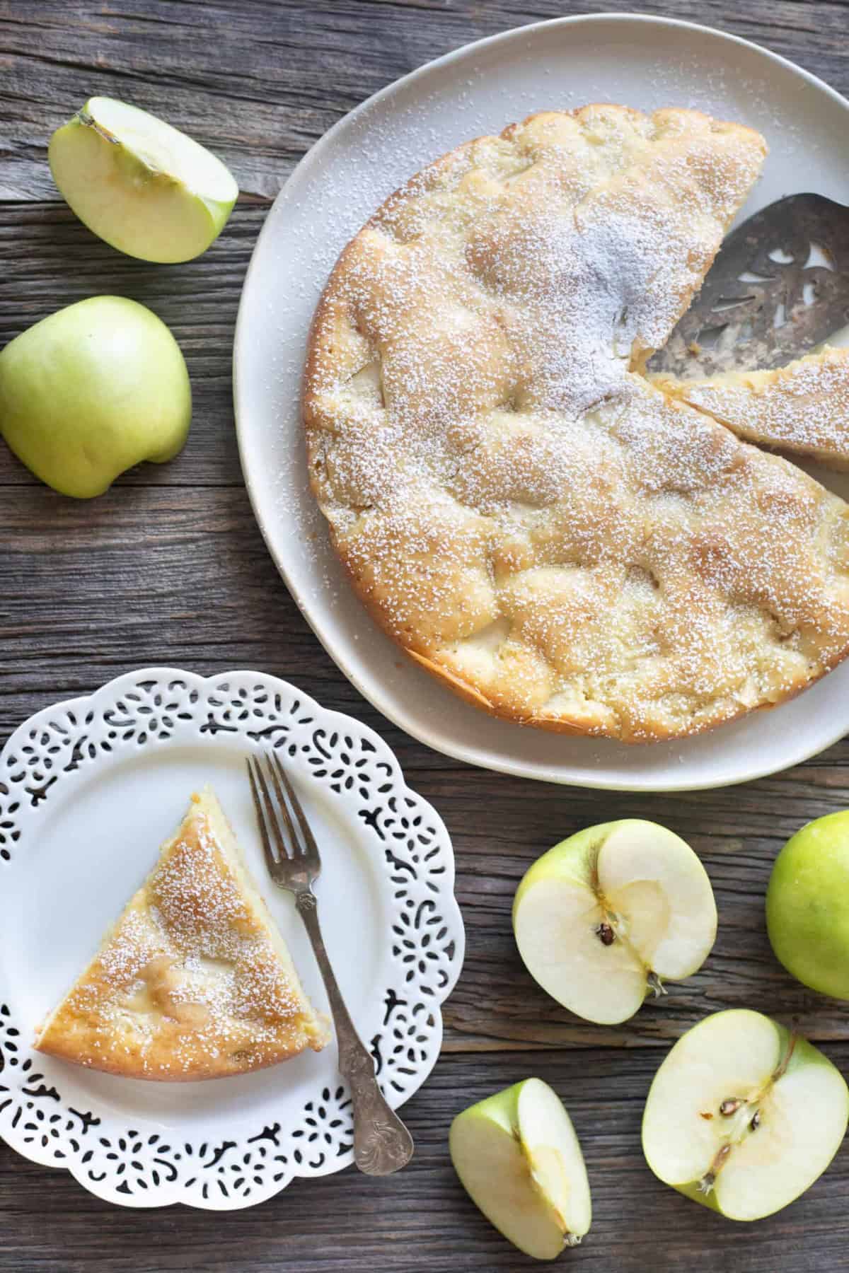 A slice of French apple cake on a plate. 
