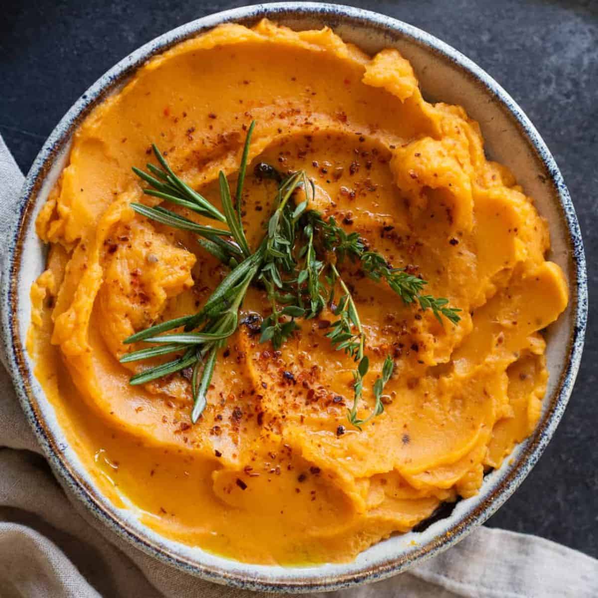 A bowl of mashed sweet potatoes.