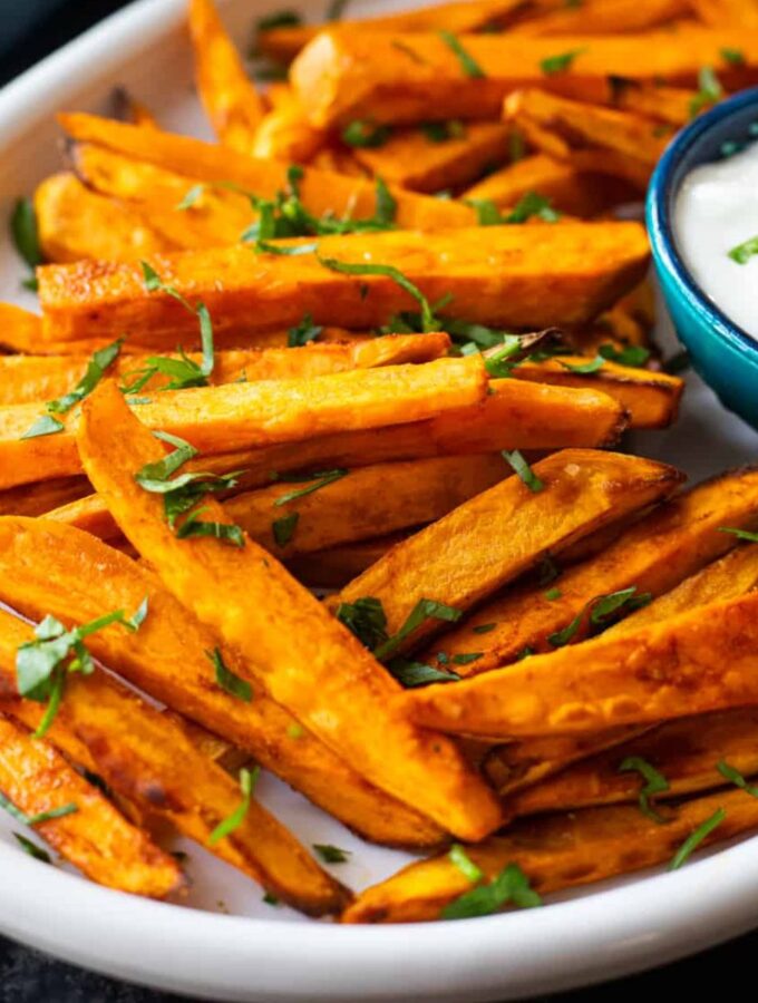 Oven baked sweet potato fries are crispy, easy to make and delicious. With a few tips and tricks, you can make the best sweet potato fries in oven. Serve as a healthy side or a midday snack.