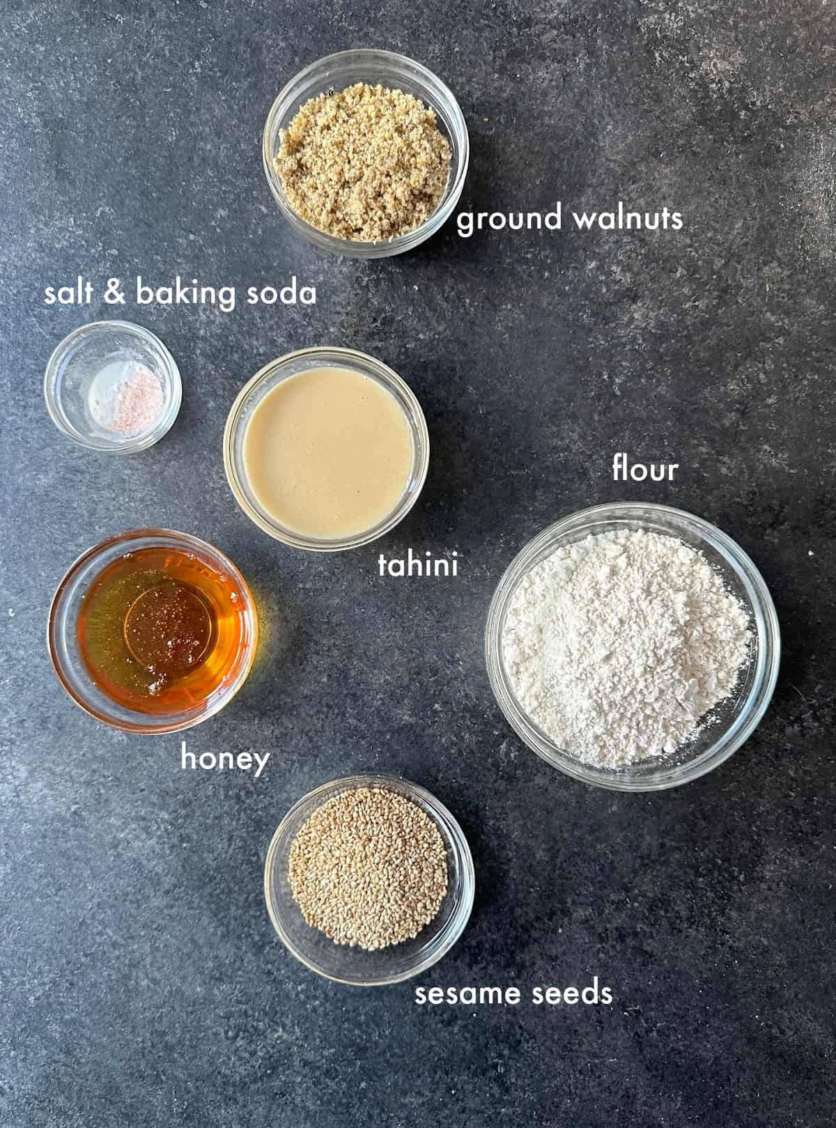 To make tahini cookies you need tahini, honey, flour, walnuts, baking soda and salt.