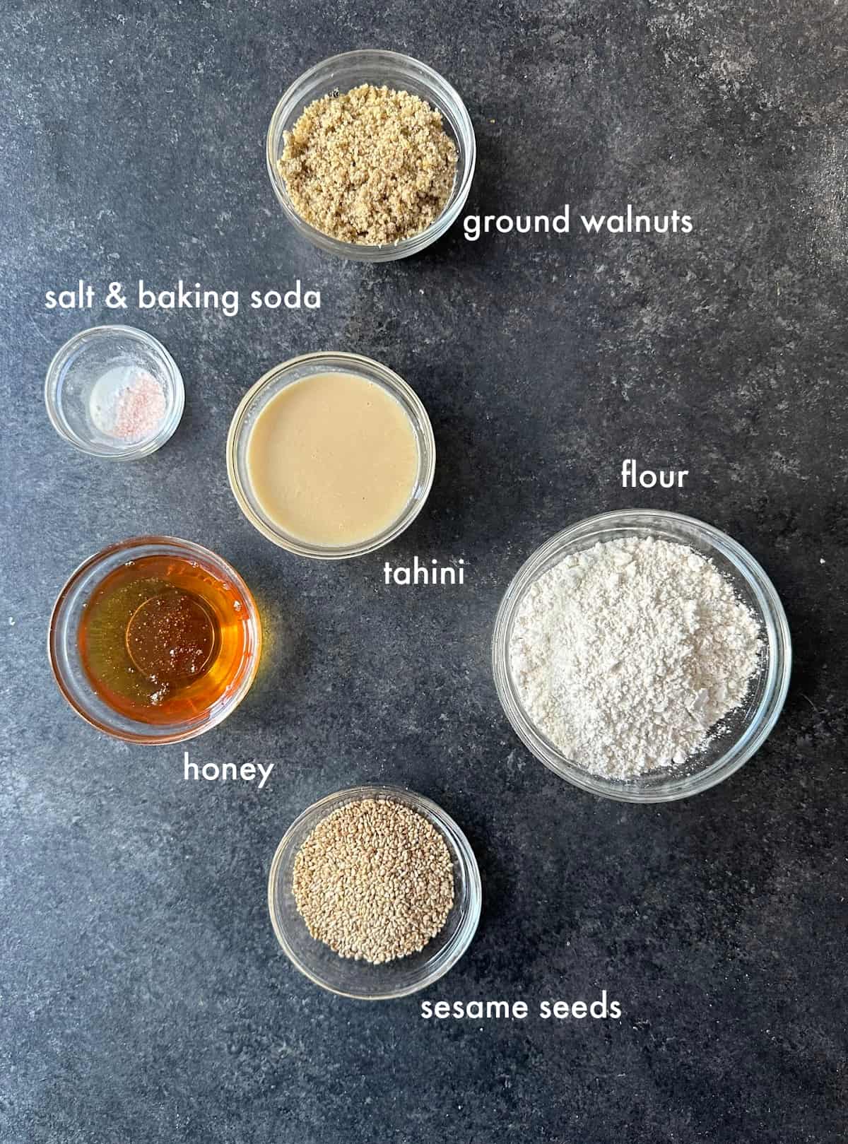 To make tahini cookies you need tahini, honey, flour, walnuts, baking soda and salt. 