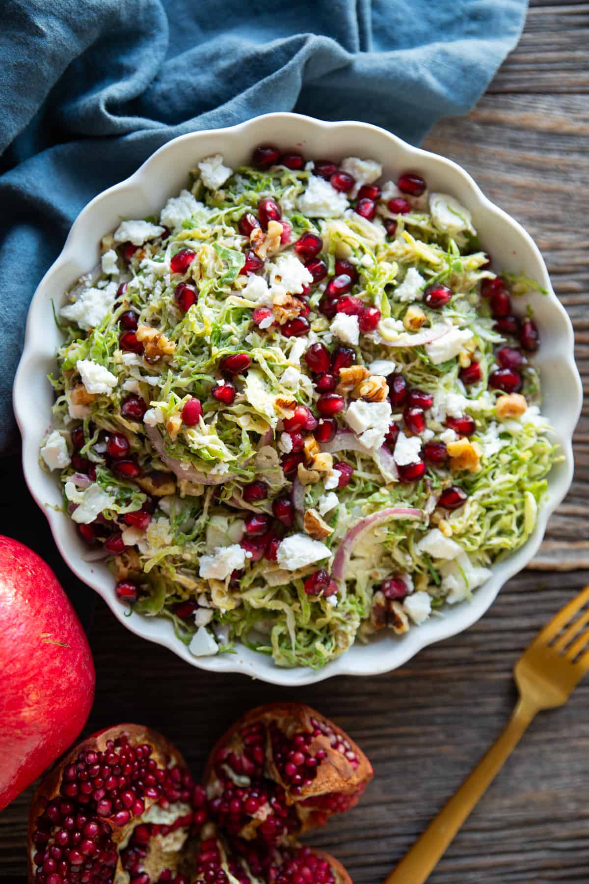 Overhead shot of brussels sprout salad with pomegranate.