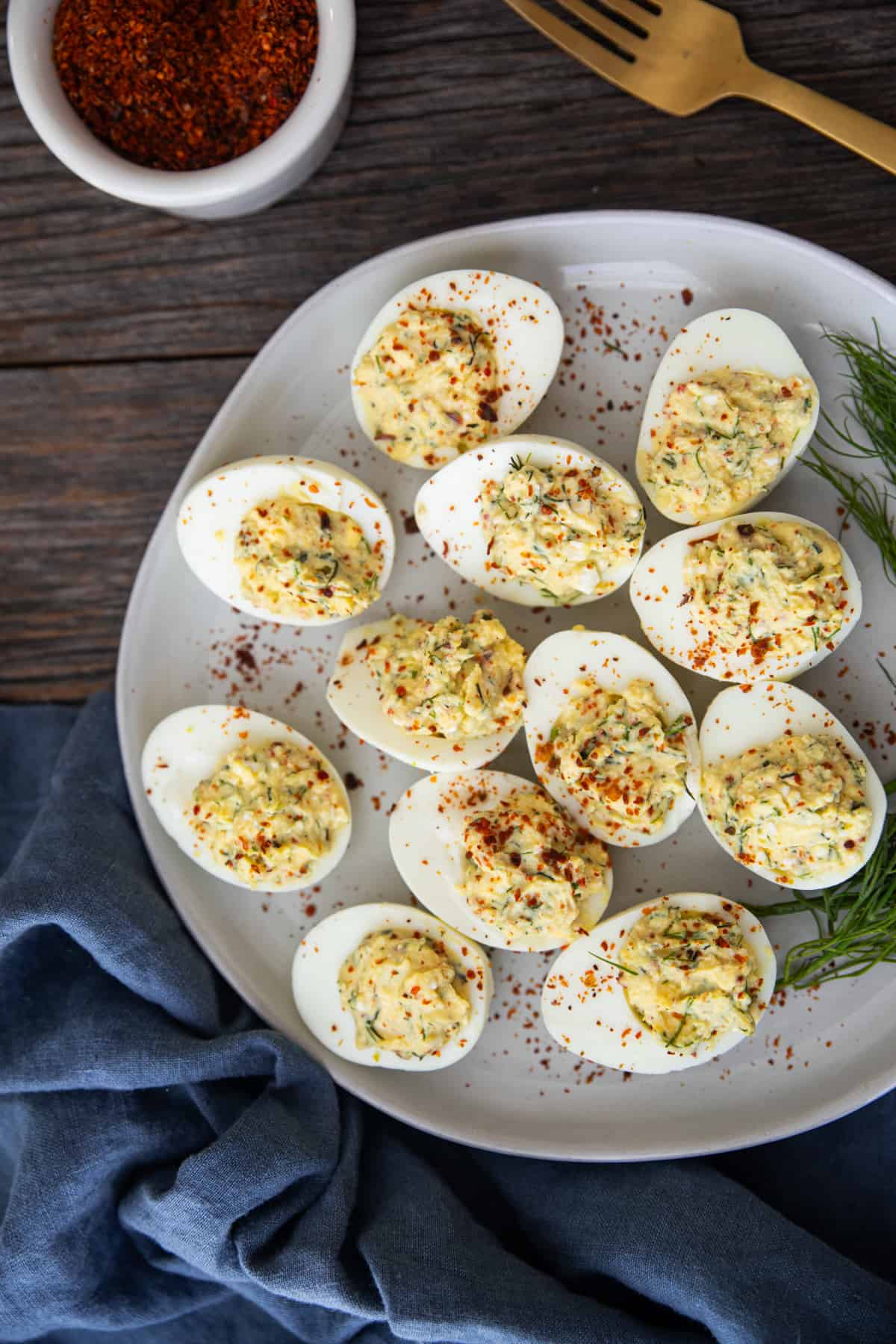 Overhead shot of Mediterranean deviled eggs on a plate.