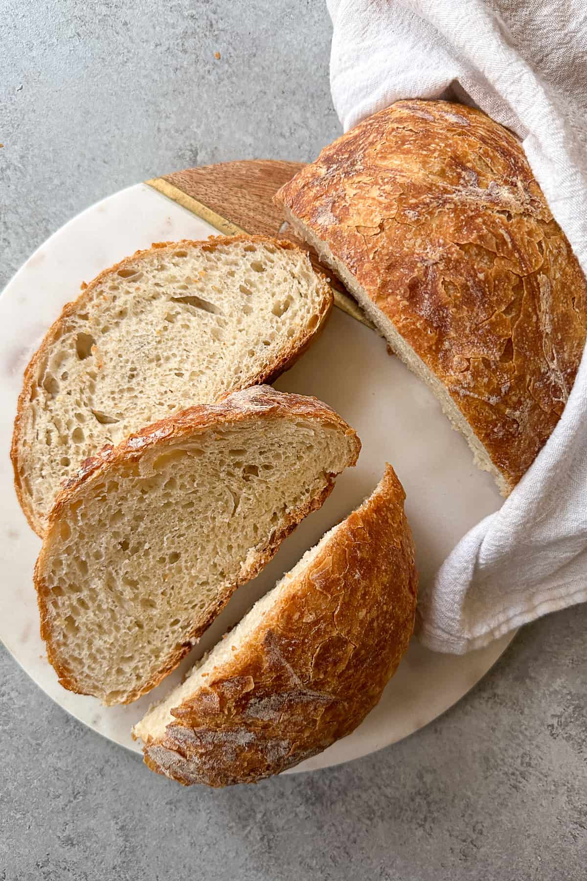 A lof of Dutch oven bread on a board. 