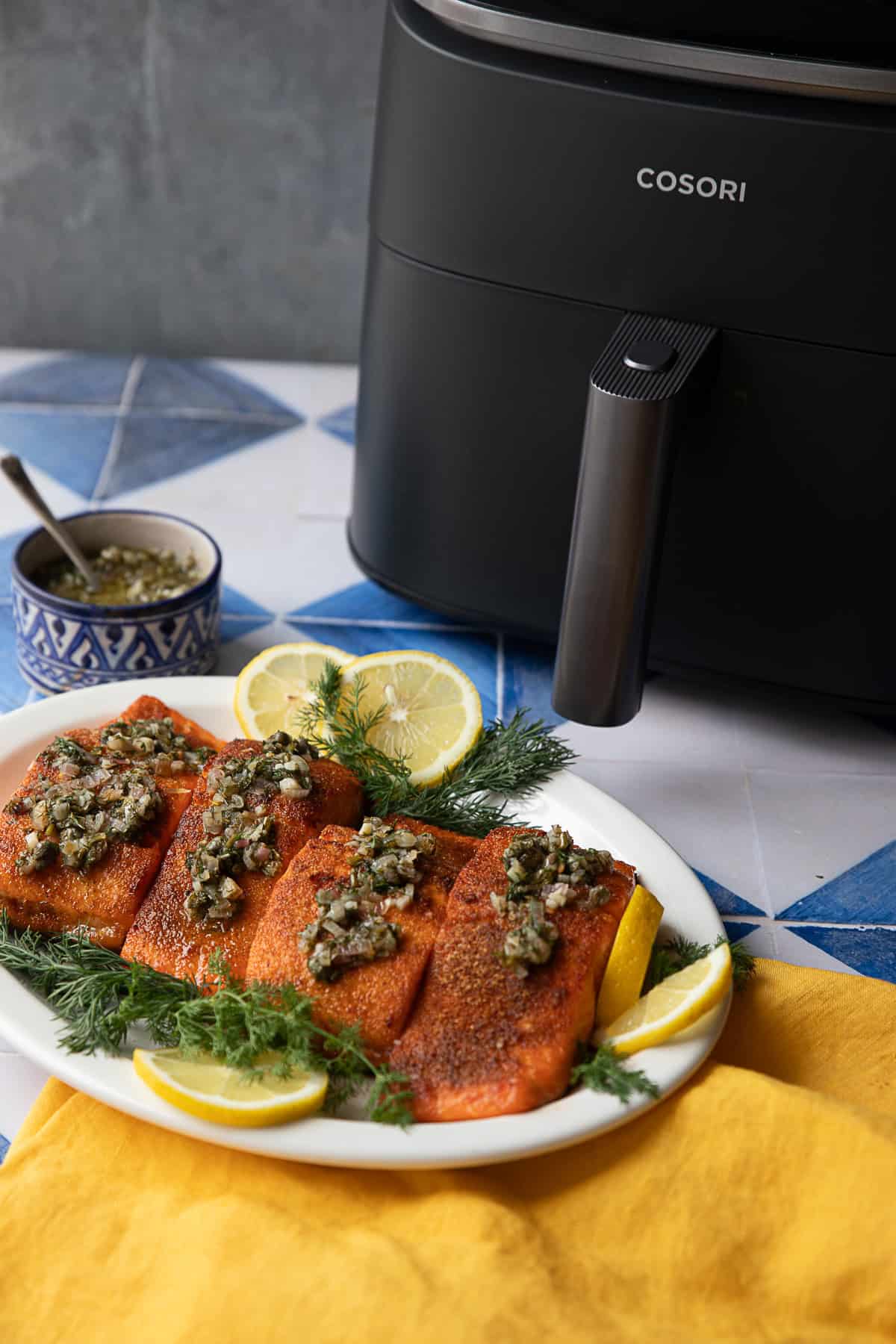 Salmon with the air fryer in the back.