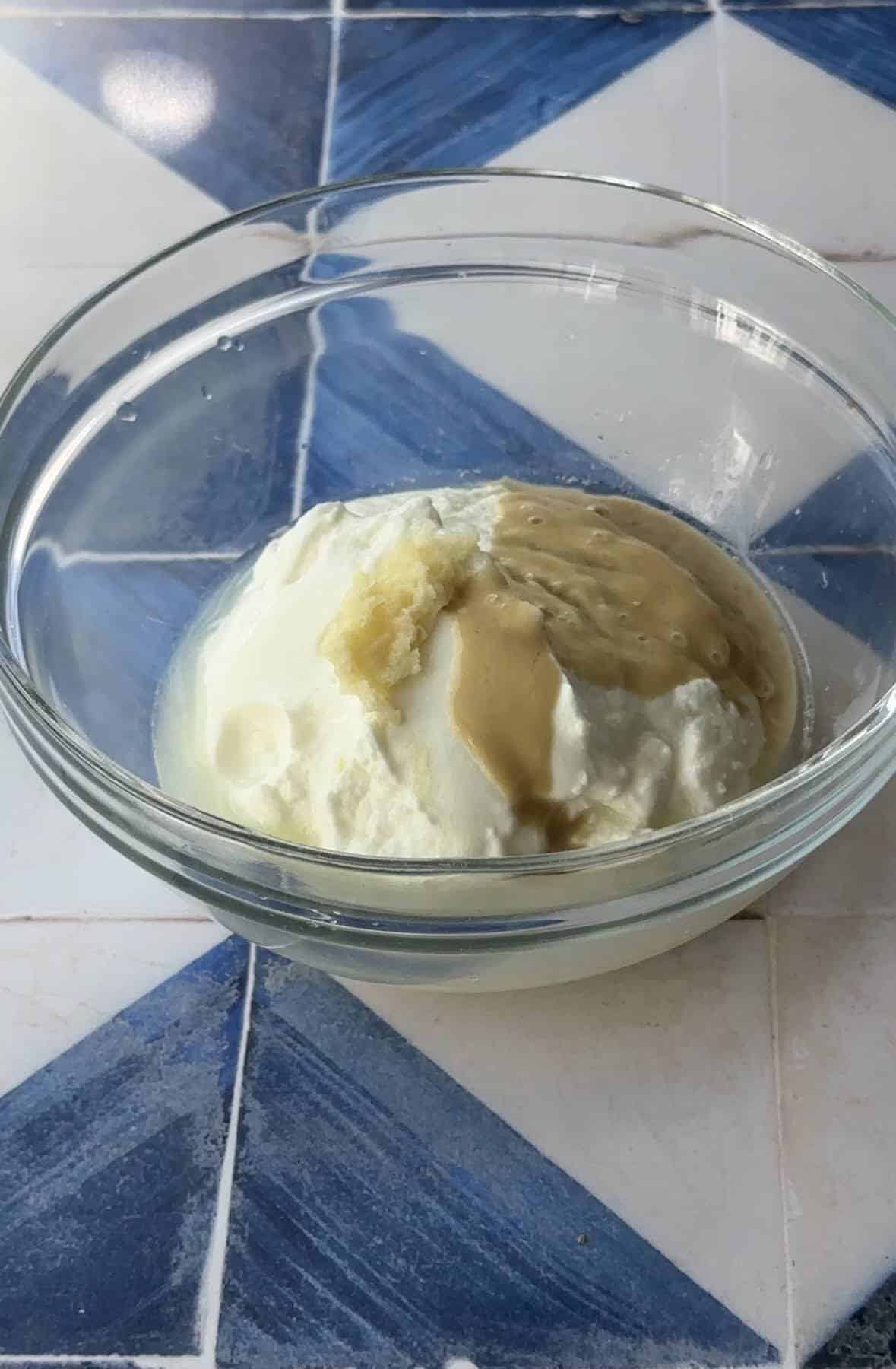 fatteh yogurt sauce ingredients mixed together in a bowl