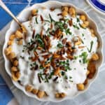 Delicious fatteh recipe featuring layers of golden pita, creamy yogurt, fragrant spices, and toasted almonds, a comforting and satisfying dish perfect for breakfast.