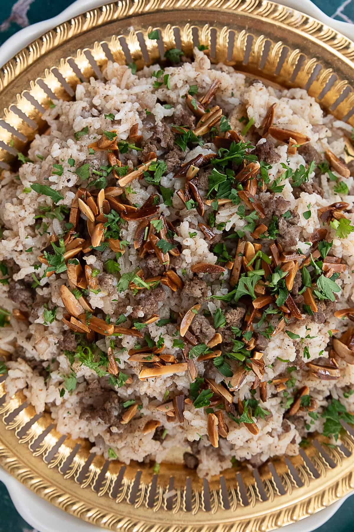 fragrant hashweh rice served with toasted pine nuts and chopped fresh parsley on top