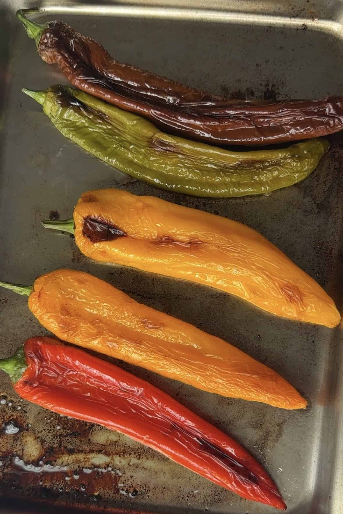 Roasted peppers on a baking sheet.