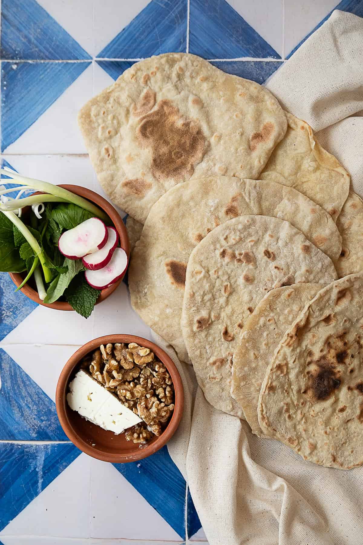 easy yeast-free flatbread served with cheese, walnuts, and veggies