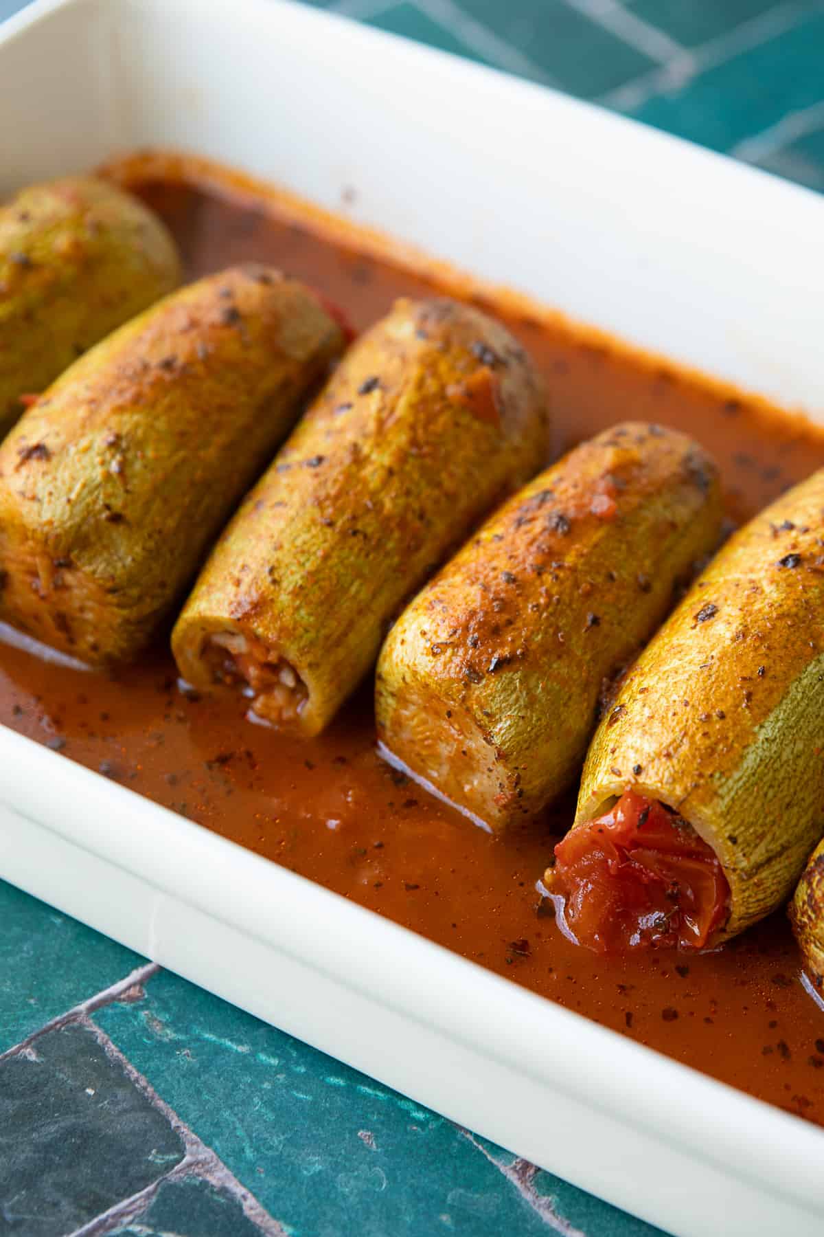 Kabak Dolmasi- Turkish Stuffed Zucchini Kabak Dolmasi- Turkish stuffed zucchini with sauce on a classic rectangle white dish