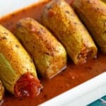 Kabak Dolmasi or Turkish stuffed zucchini in an aromatic tomato sauce