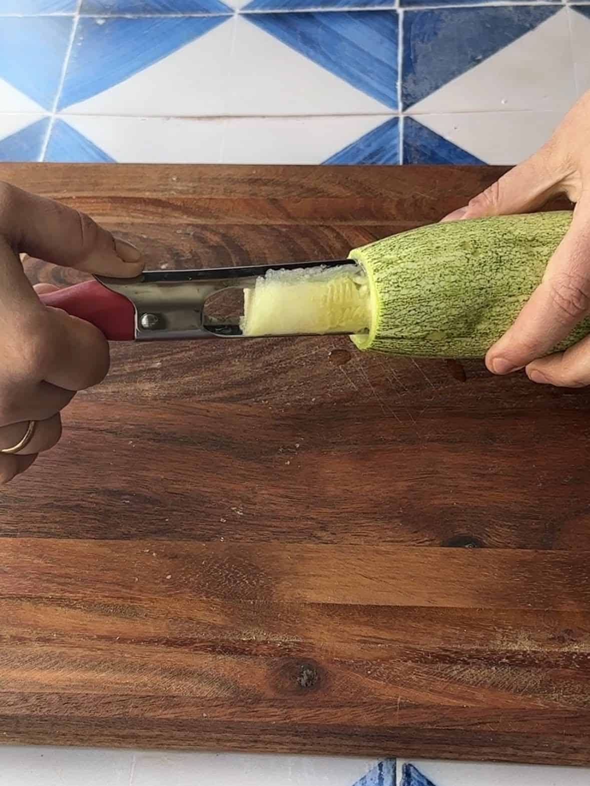 Coring Zucchini use an apple corer to core the zucchini and empty out its content