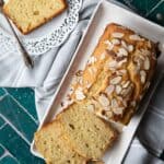 light and moist yogurt cake in a rectangle serving dish with a smaller slice of cake in a smaller serving dish next to it