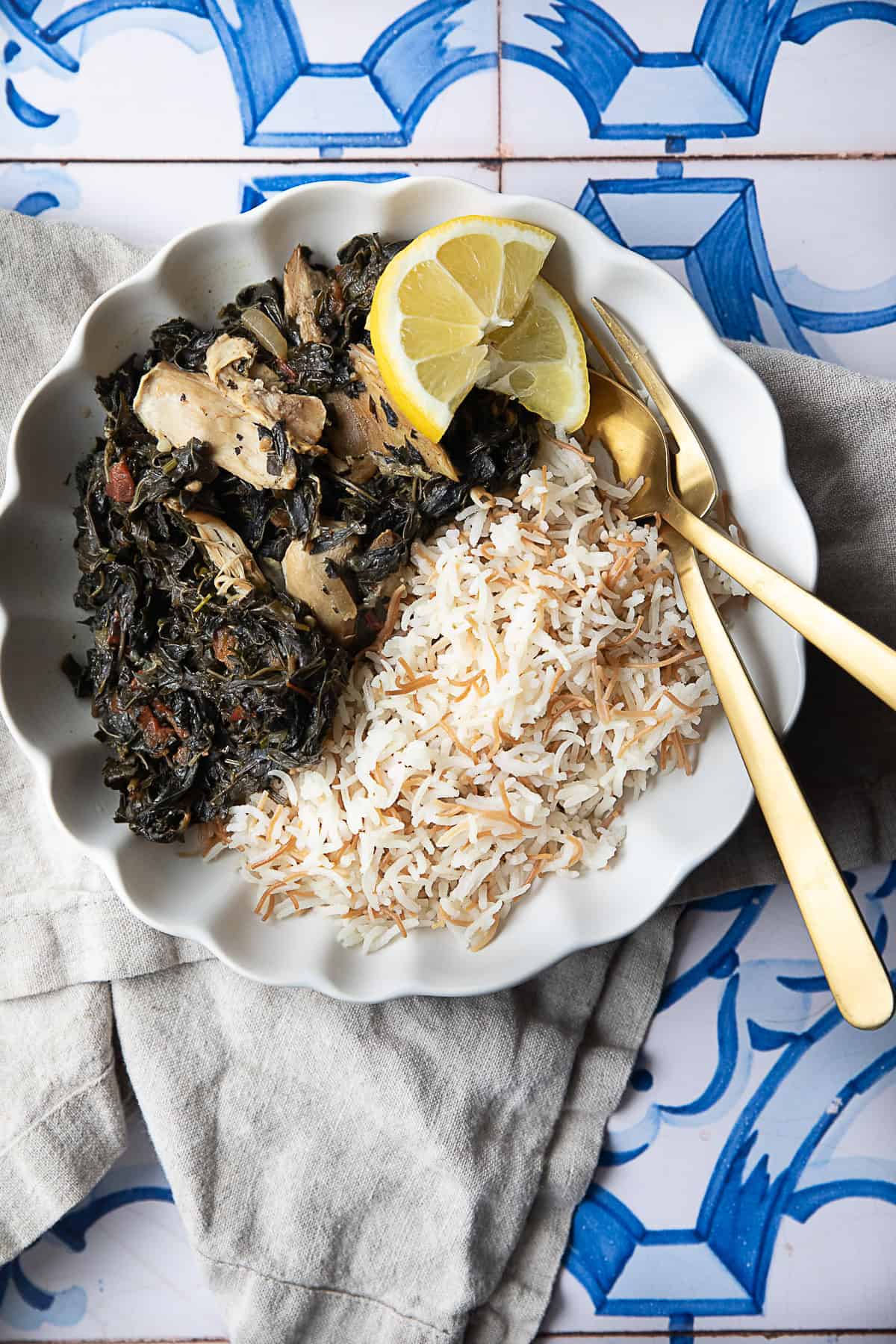 Molokhia (Mloukhiyeh) w Roz molokhia w roz (rice) served in a white bowl with lemon wedges