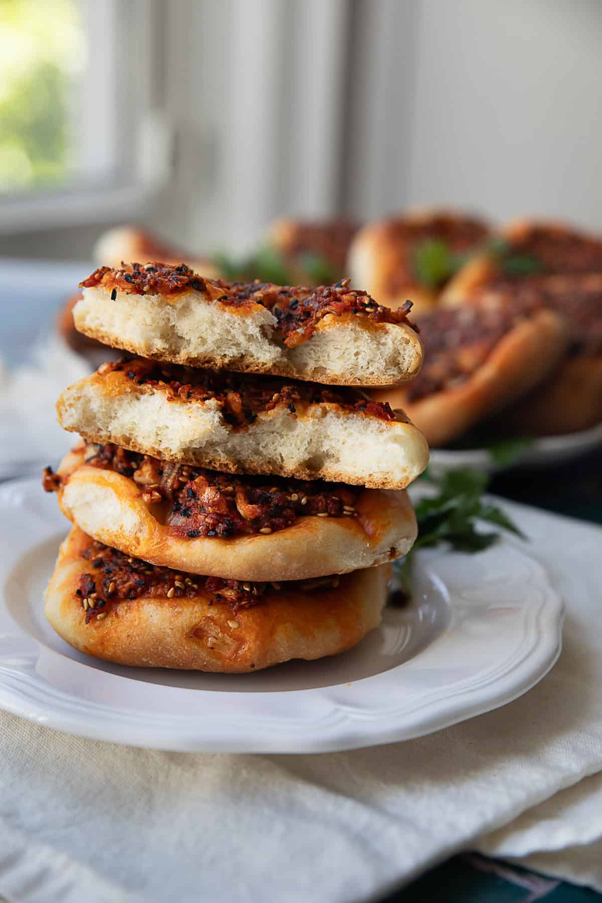 Biberli Ekmek Hatay Bread Hatay red pepper paste bread or biberlik ekmek served in a white plate