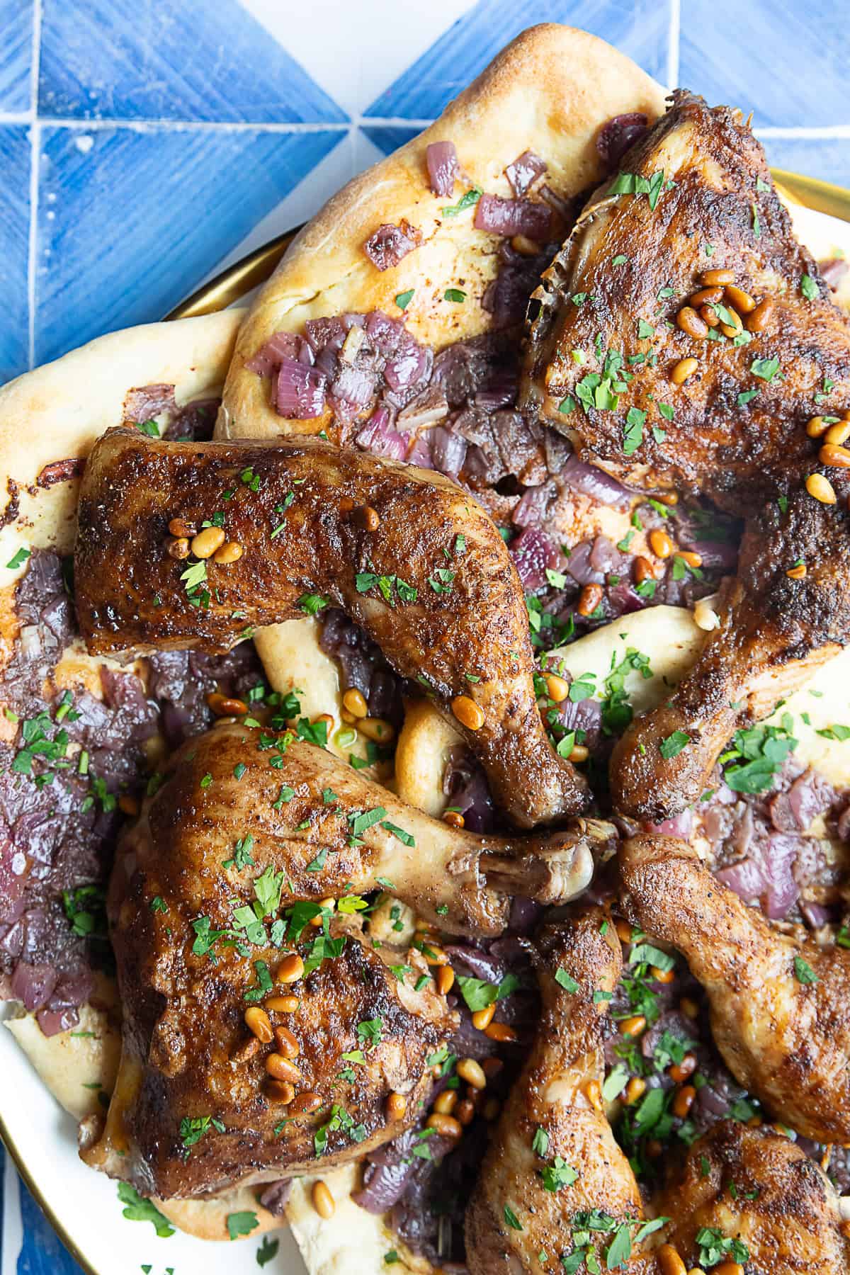 Authentic Musakhan musakhan or Palestinian sumac and onion chicken served on taboon flatbread