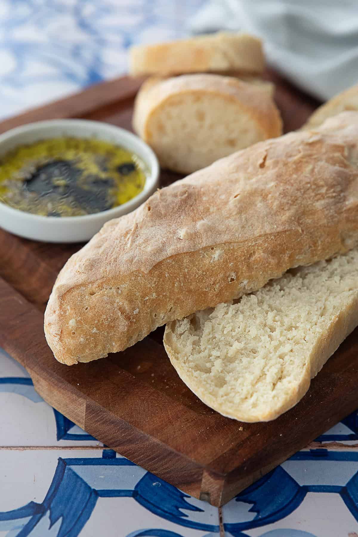 Ciabatta Bread Ciabatta bread cut into slices, showcasing its airy, open crumb and golden-brown crust.