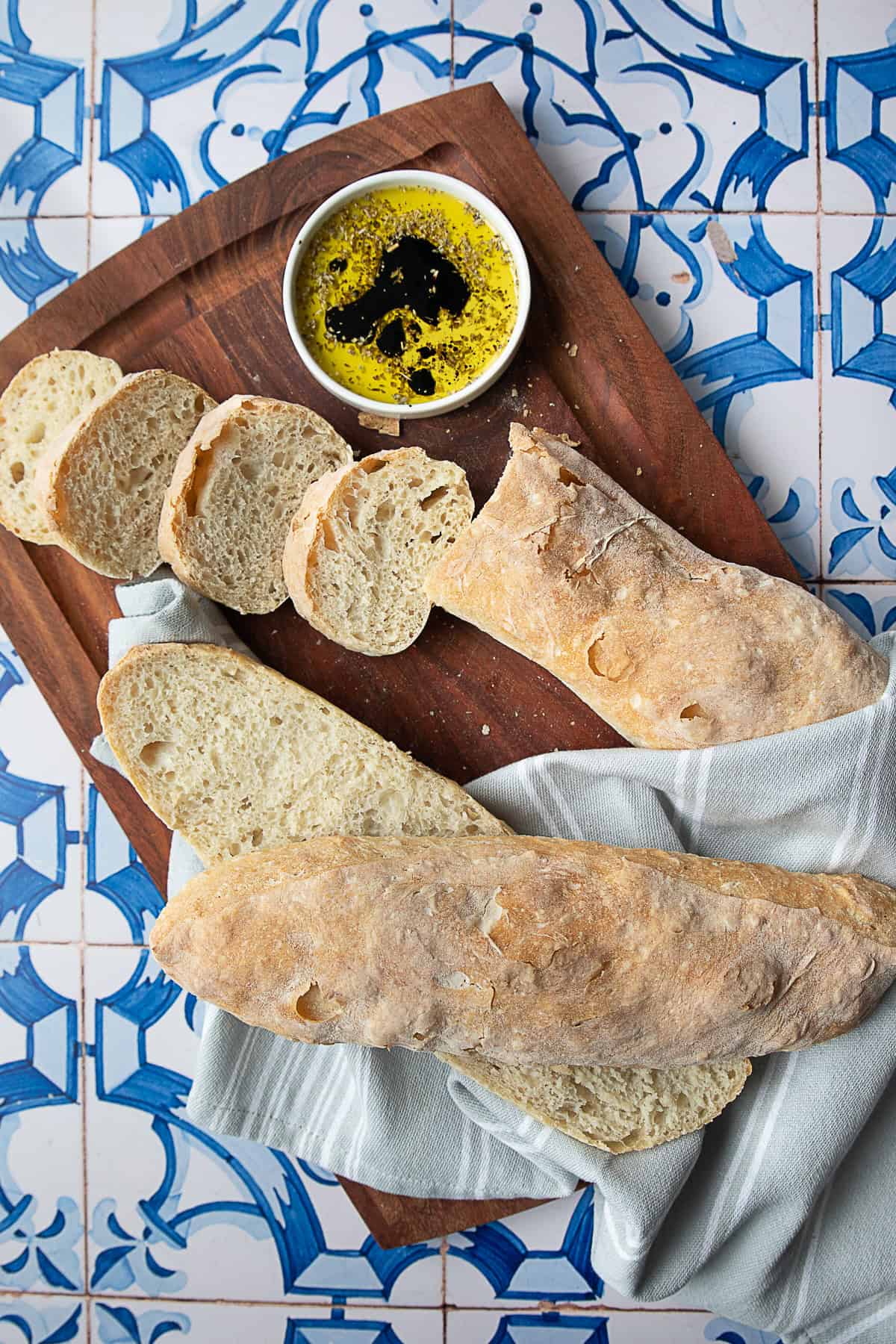 ciabatta recipe easy Freshly sliced ciabatta bread, showing the soft, open crumb and the crust’s crisp, golden-brown texture.
