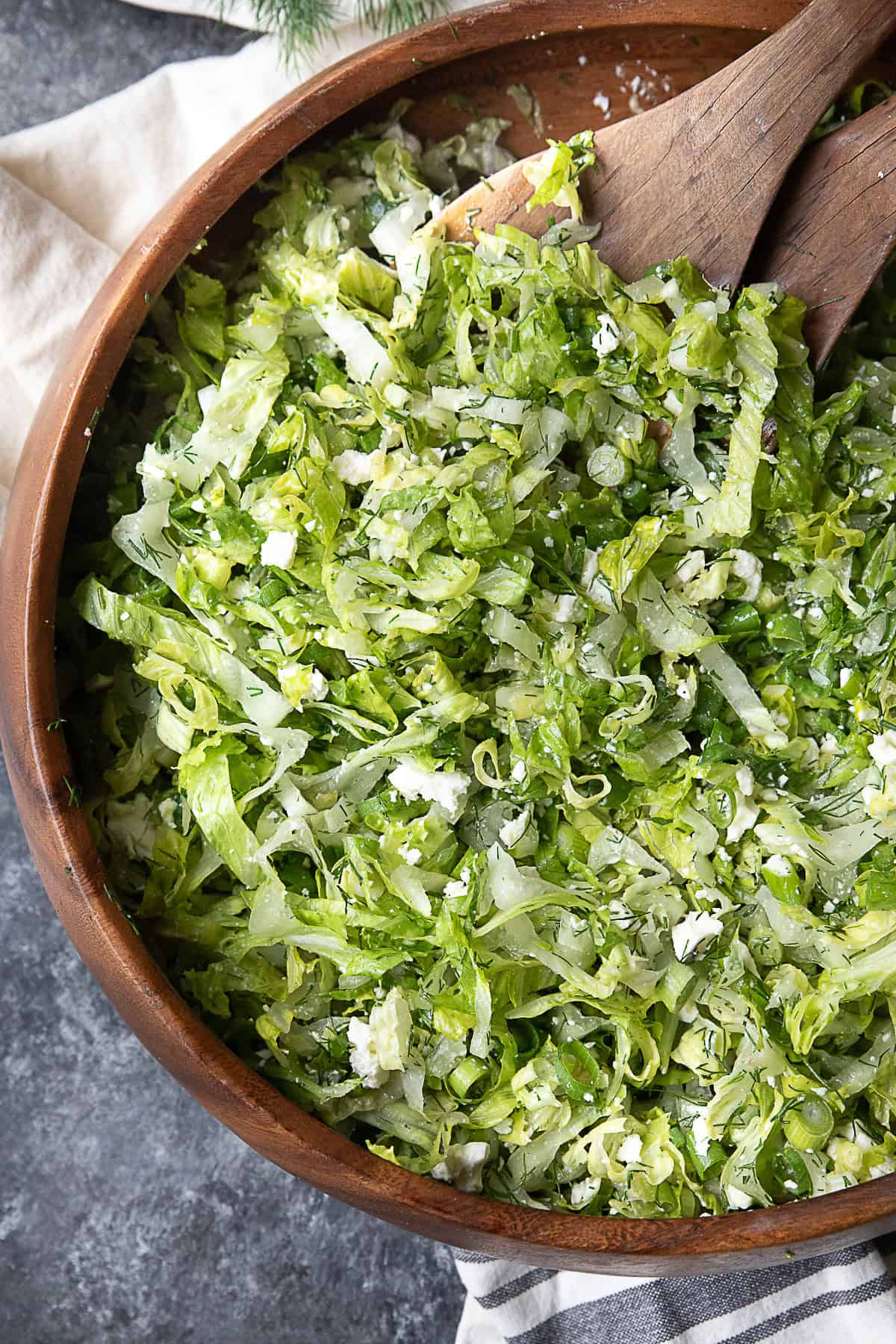 Classic Greek Lettuce Salad A wooden bowl packed with freshly chopped Maroulosalata.