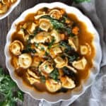 Tortellini soup in a bowl.