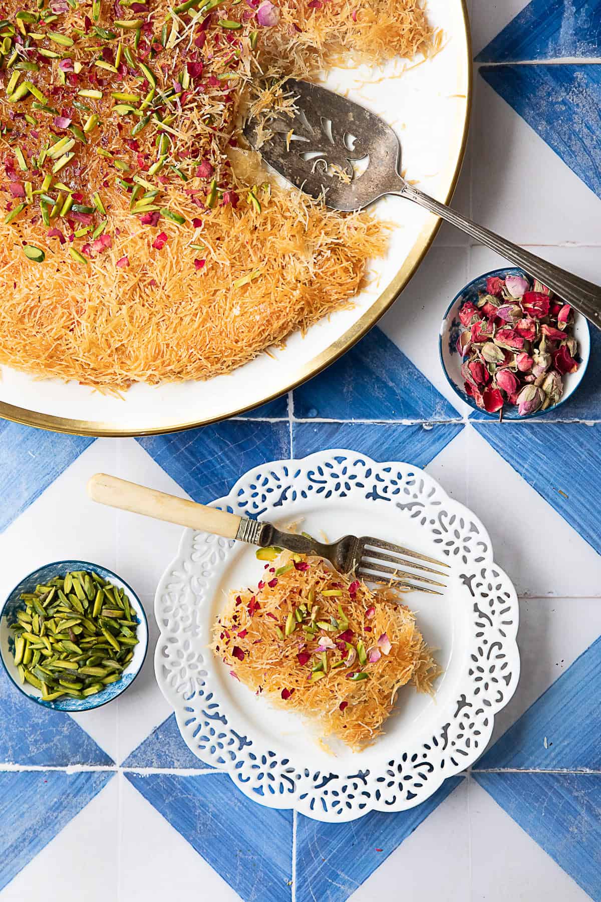 golden crispy kunafa drizzled with simple syrup and garnished with pistachios