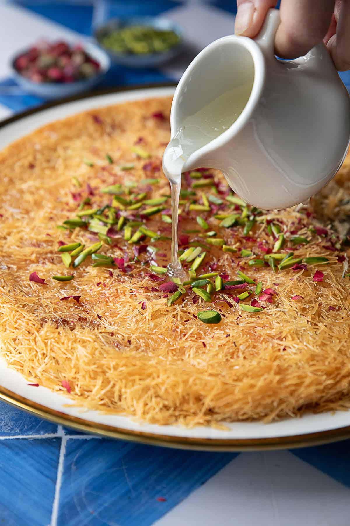 Kunafa is a popular Middle Eastern dessert featuring layers of crispy pastry and sweet cheese soaked in syrup. It is crispy on the outside, cheesy and gooey on the inside, and absolutely delicious!