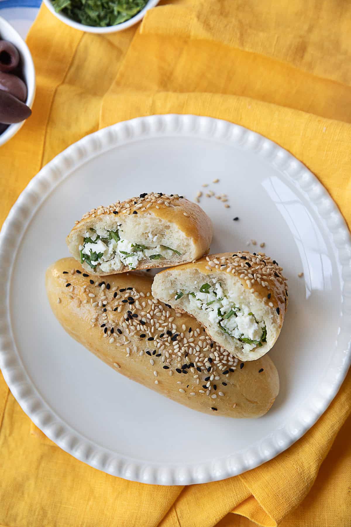 Turkish Pogaca Bread Cheese filled Turkish pastries on a white plate.