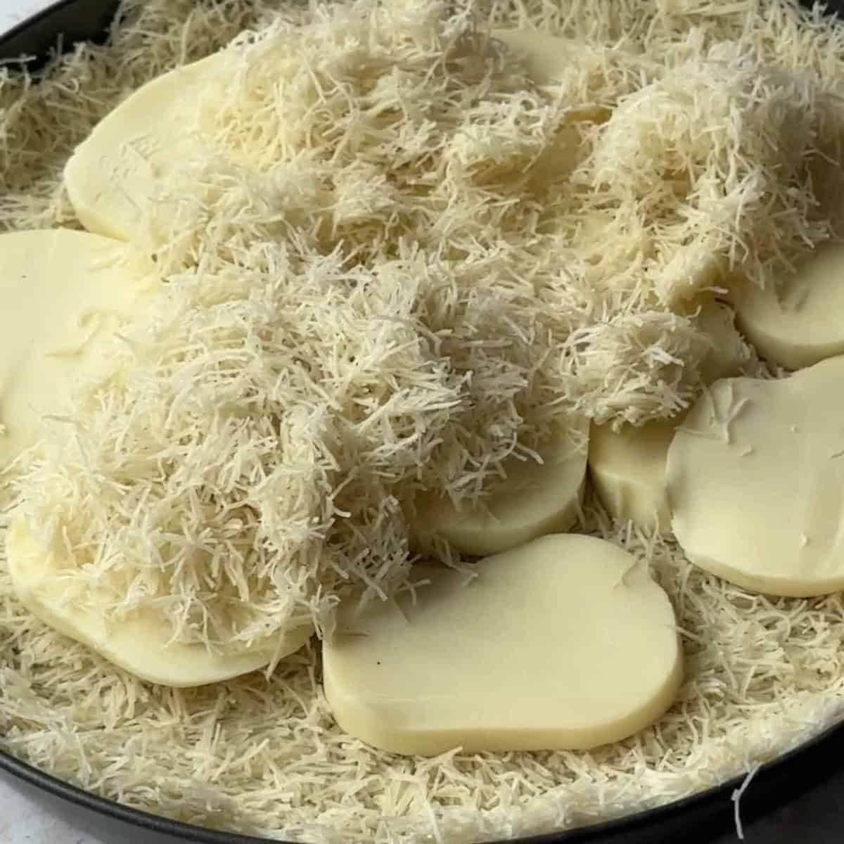 a thin layer of katayif covering mozzarella cheese
