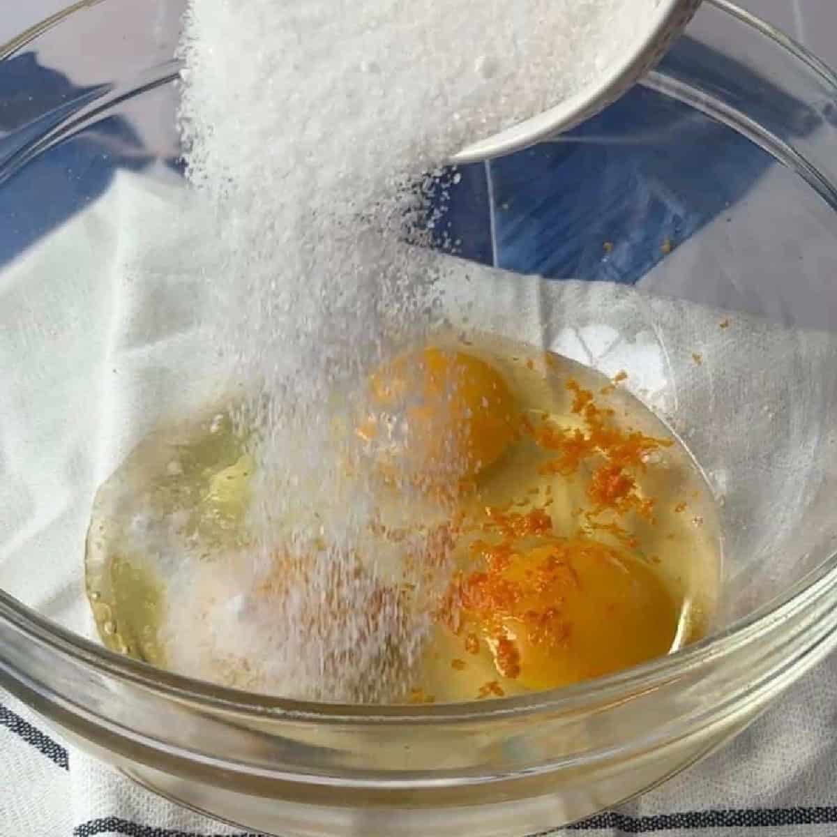 How To Make Greek Orange Cake add the sugar to eggs .