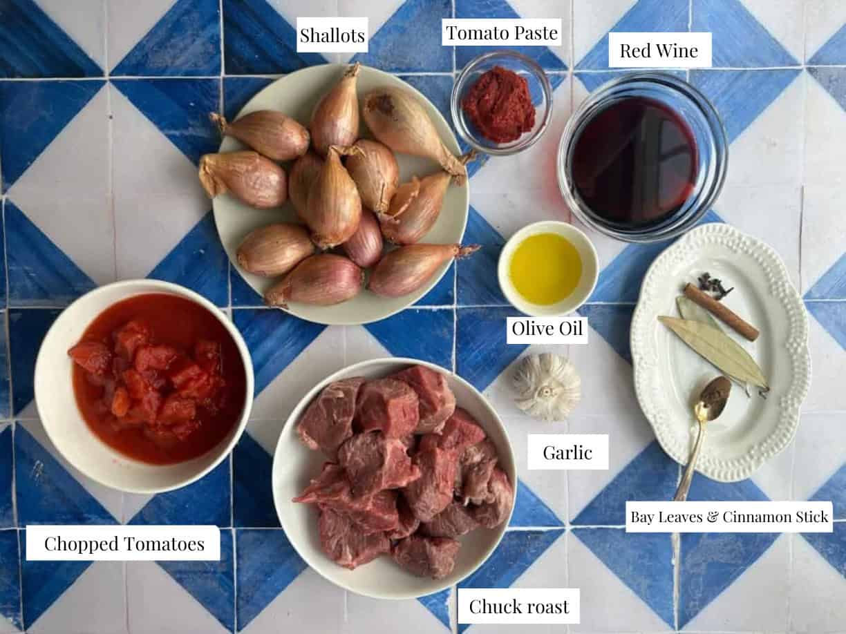 To make stifado you need beef, shallots, tomato paste, spices and red wine and olive oil.