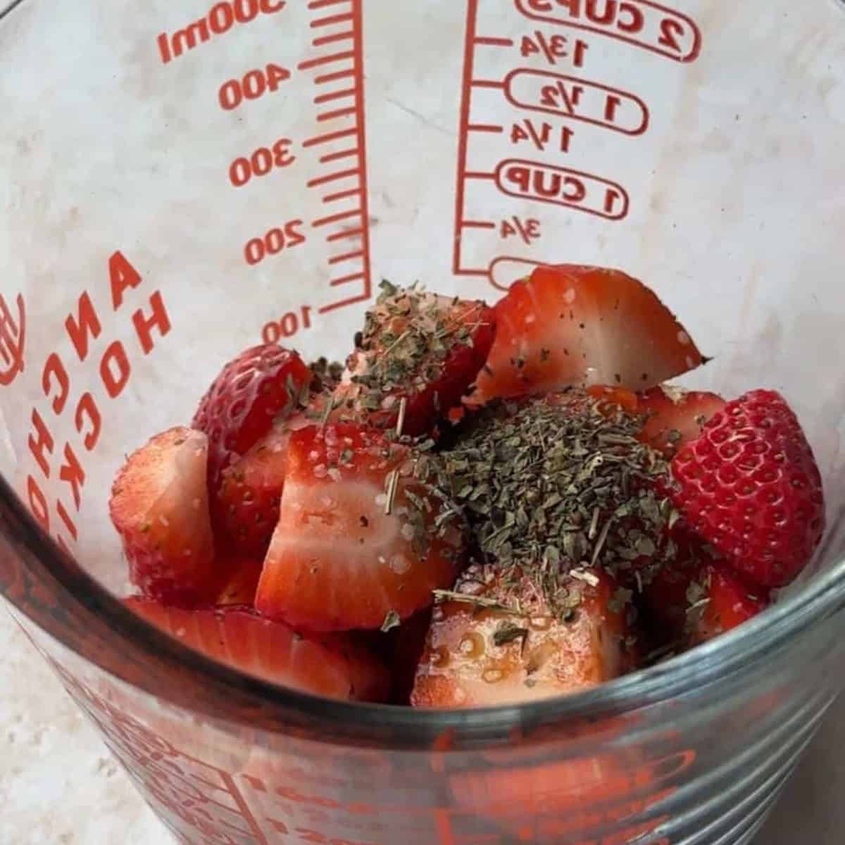 How to Make Strawberry Vinaigrette Add strawberries, dried basil, balsamic vinegar, olive oil and salt