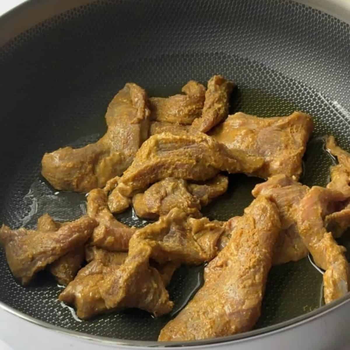 Easy Authentic Homemade Lamb Shawarma sear lamb shawarma with oil in pan