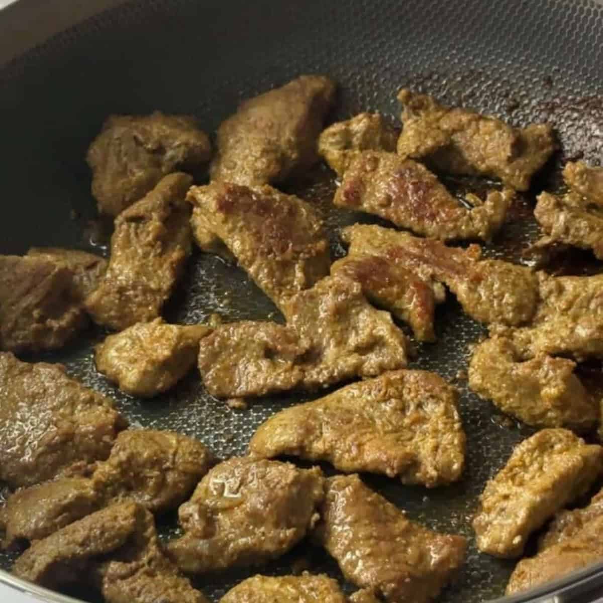 Easy Authentic Homemade Lamb Shawarma sear lamb shawarma with oil in pan