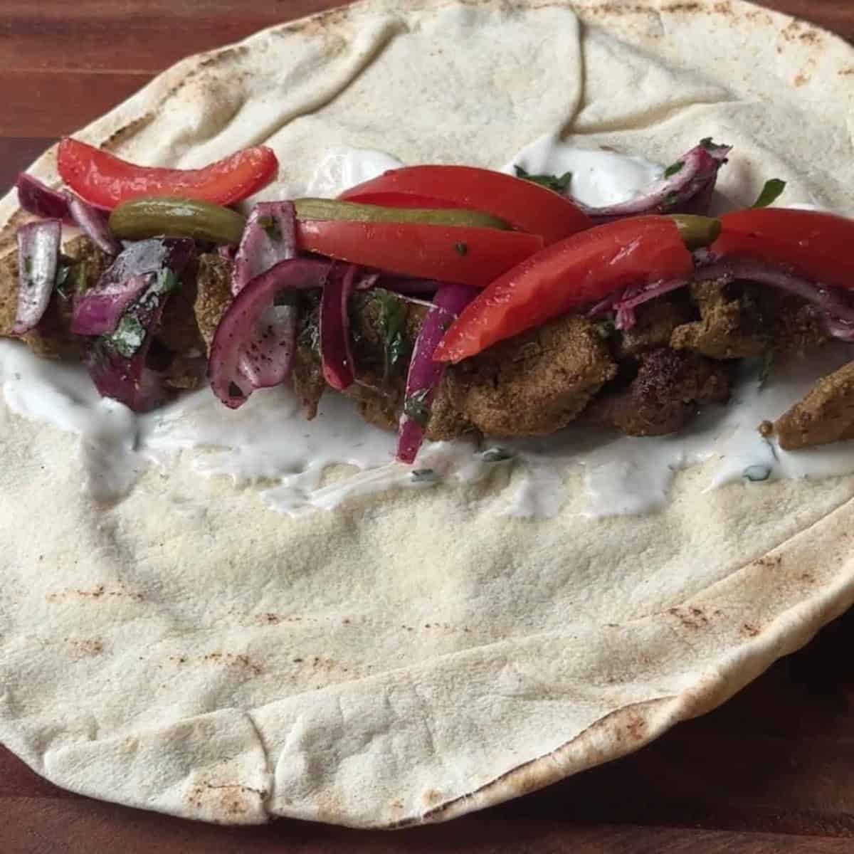 How to Make Lamb Shawarma wrap begin assembling shawarma wrap