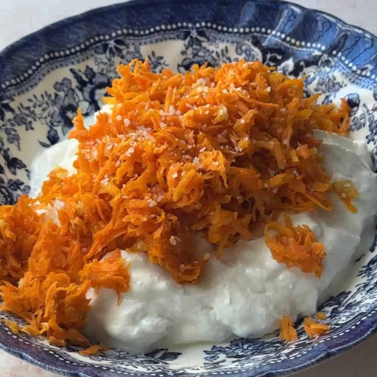 How to Make Carrot Salad with Yogurt add cooled garlic and carrots to Greek yogurt with salt