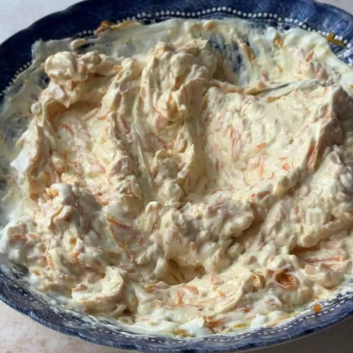 How to Make Carrot Salad with Yogurt mixed carrot salad with yogurt in a bowl