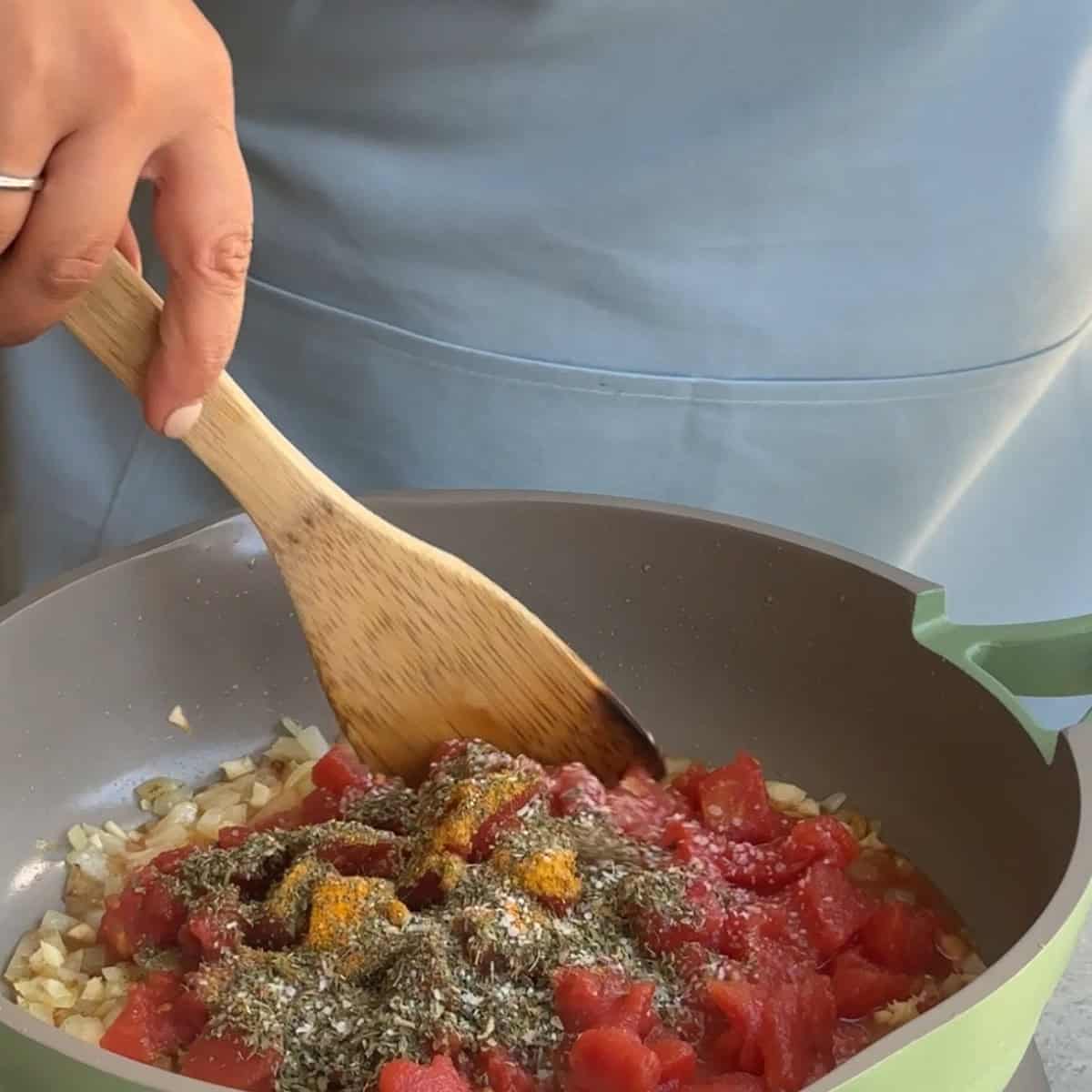 How to Make Borani Kadoo saute onions and add tomatoes and spices