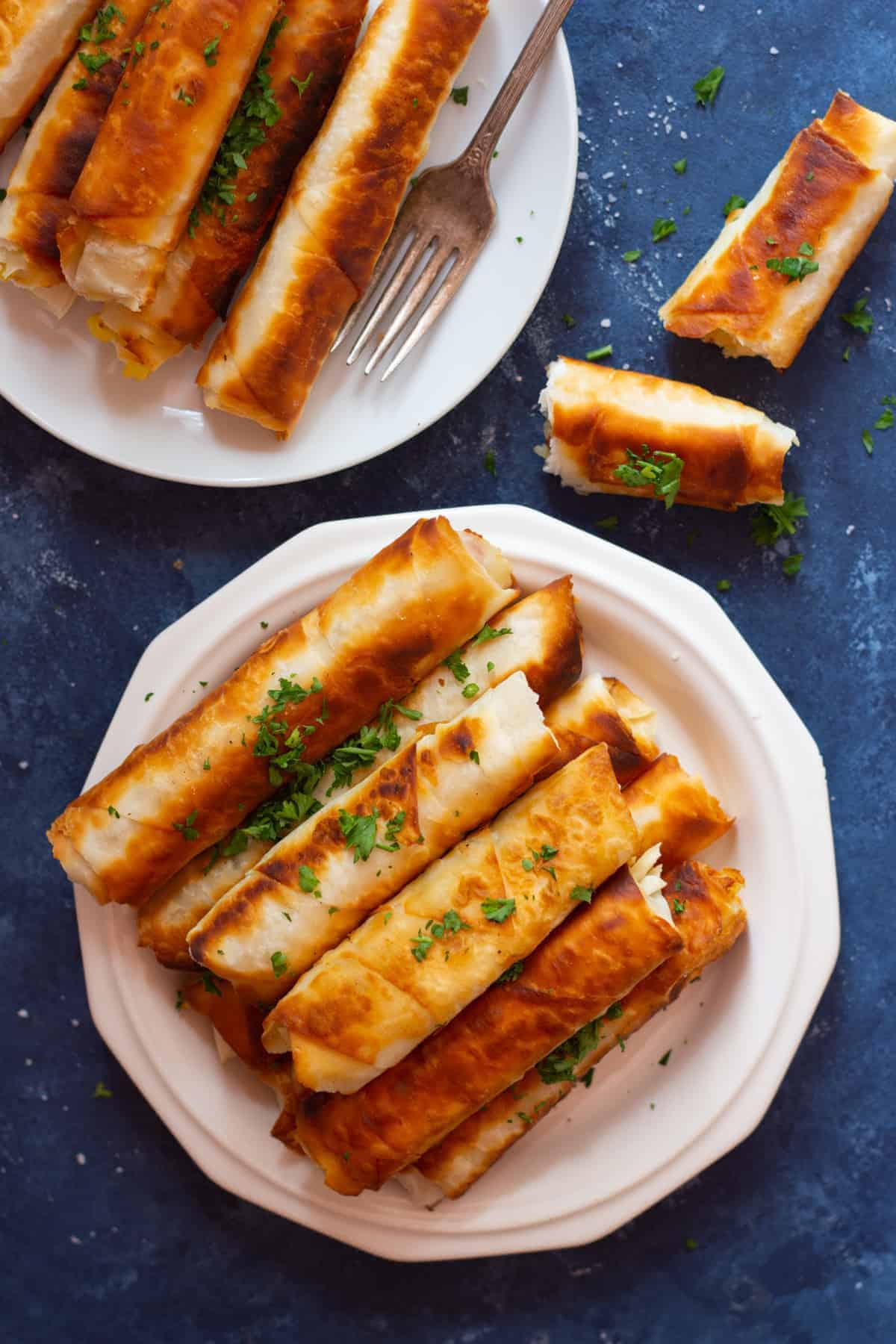 Borek is a Turkish savory crunchy pastry filled with different fillings such as cheese or potatoes. Learn how to make Turkish borek recipe by watching our step-by-step video and tutorial. They are perfect as a midday snack or for breakfast and you can make them in advance and freeze them for later. 
