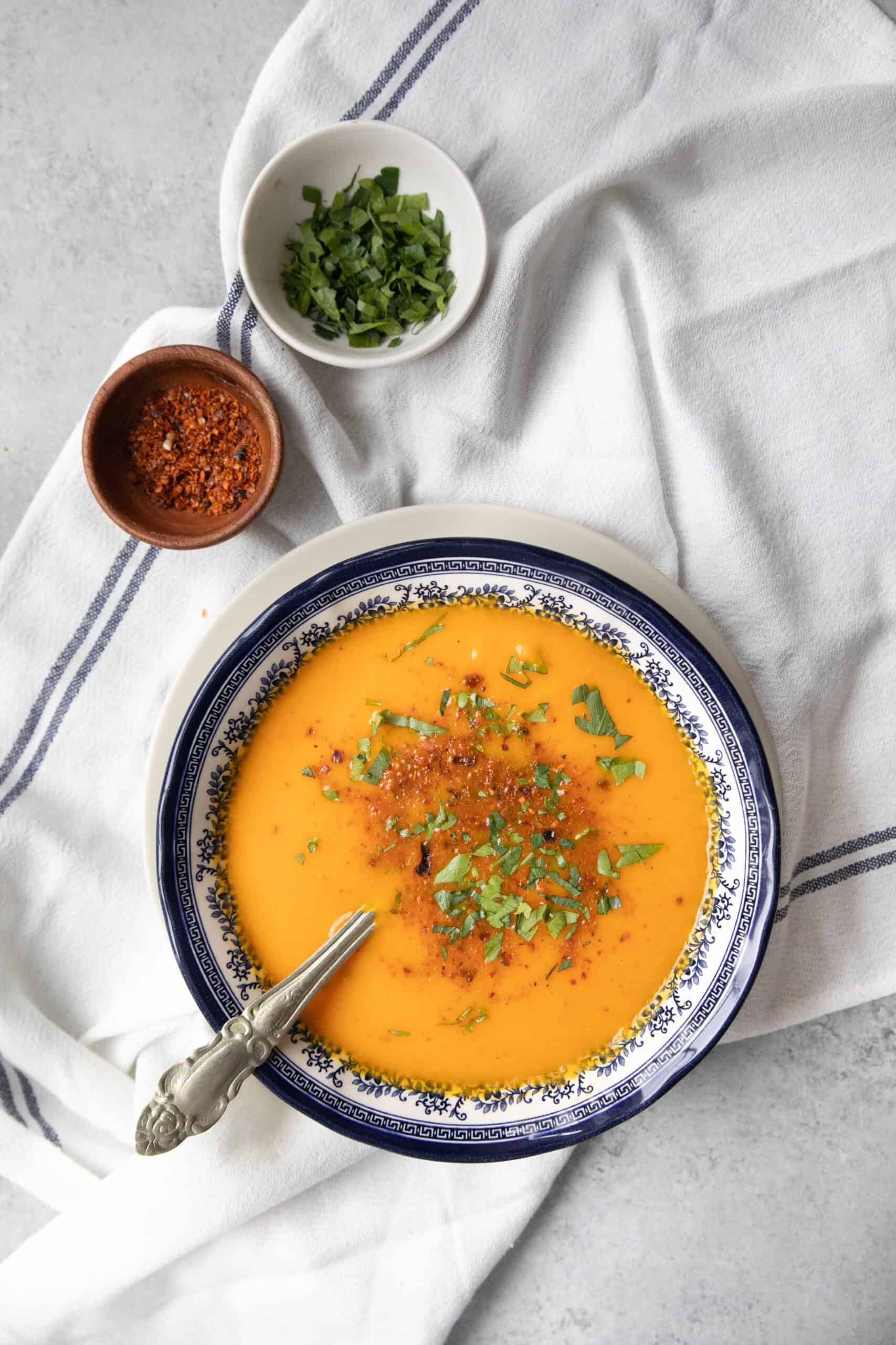 Roasted Carrot Soup Recipe a bowl of roasted carrot soup with garnish