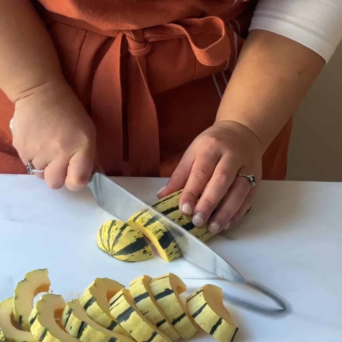 How to Make Roasted Delicata Squash slice squash into quarters