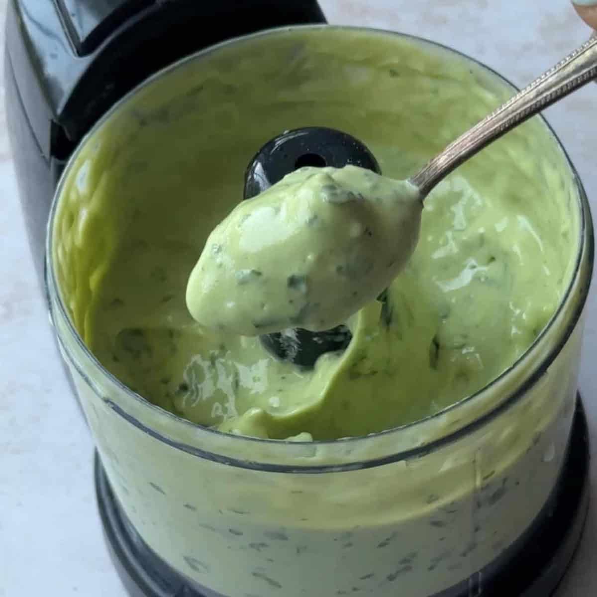a spoon of greek yogurt avocado dressing after been possessed 
