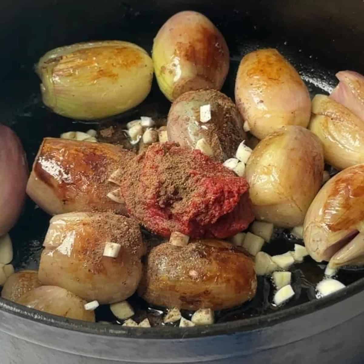 Add in the red wine to deglaze.