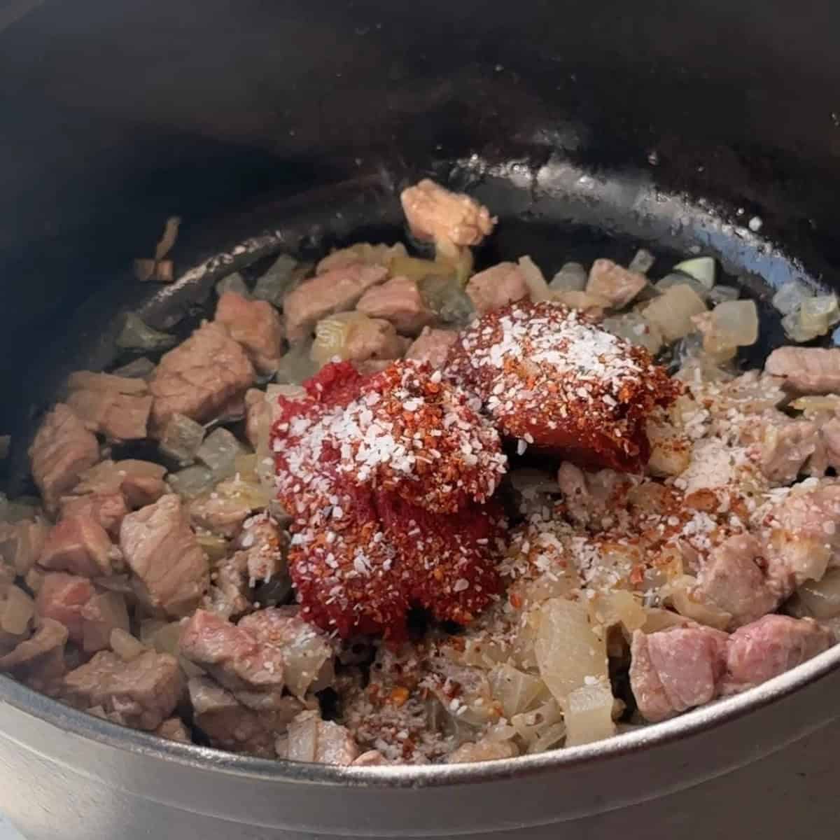 How to Make Turkish Bean Stew add tomato and pepper pastes and spices