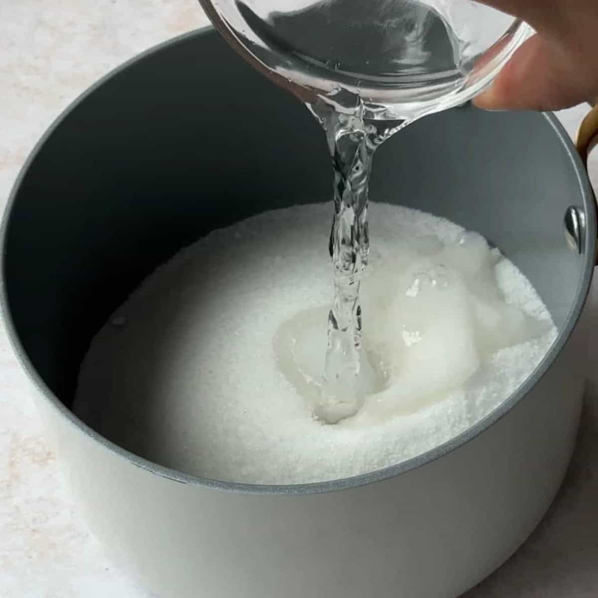 step by step tahini halva prepare the simple sugar syrup by adding the sugar and the water to a pot and cooking