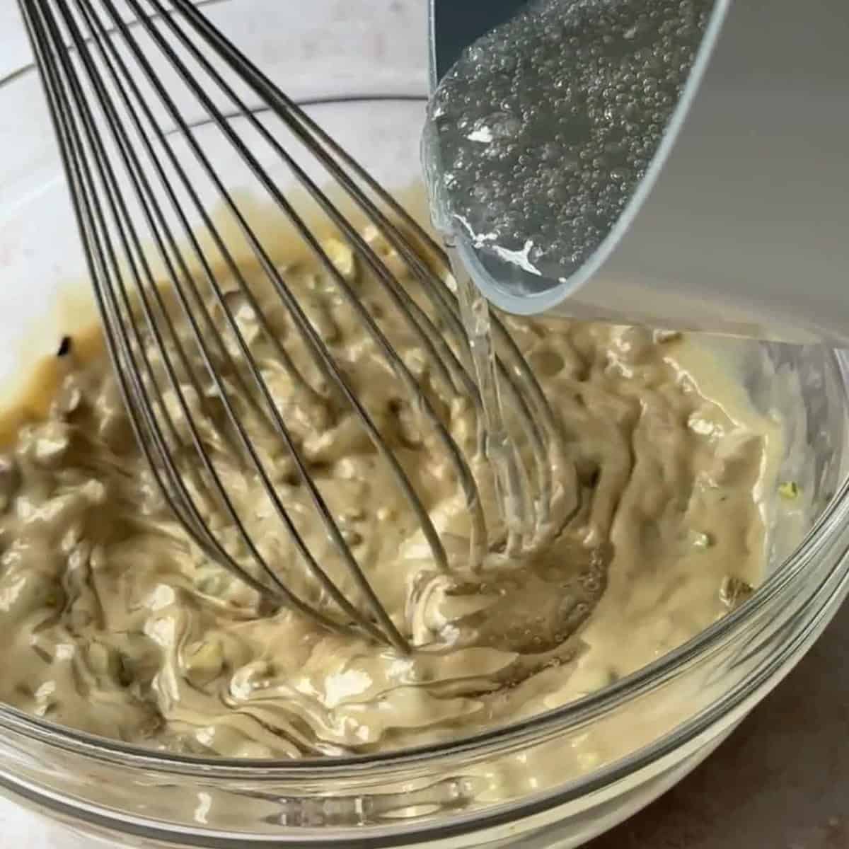 step by step tahini halva add the syrup to the tahini mixture and mix