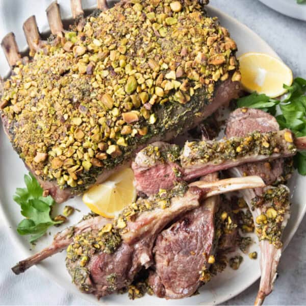 herb crusted rack of lam and sliced lamb.