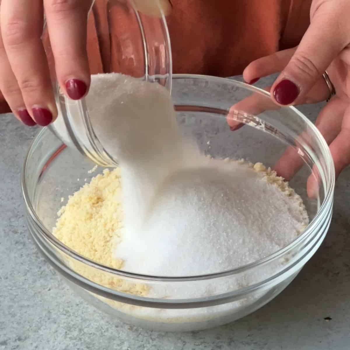 How to Make Amaretti Cookies add almond flour and sugar together in a bowl